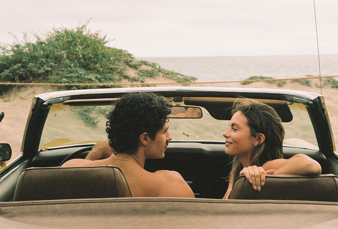 Couple in convertible at the coast — Br'eau lifestyle
